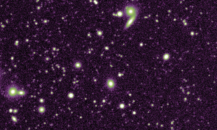 Figure 1 (taken from Debattista et al, 2017, MNRAS, 469, 1587). This plot shows the age distribution of stars in a simulation of the evolution of the stars in the Milky Way. The map is defined on a coordinate grid of (l,b), which are, respectively, Galactic Longitude and Latitude, and only the central portion of the Milky Way is plotted here. Black contours trace the age distribution (with ages indicated by the colour bar to the right of the plot), while red contours show lines of constant stellar density.
